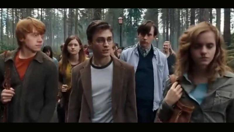 Scene from the Harry Potter series Harry Potter and the Order of the Phoenix showing Harry and his two companions, Ron and Hermione walking away from the famous Hogwarts castle.
