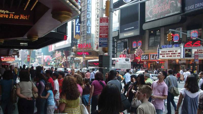 A busy city street with people and traffic.