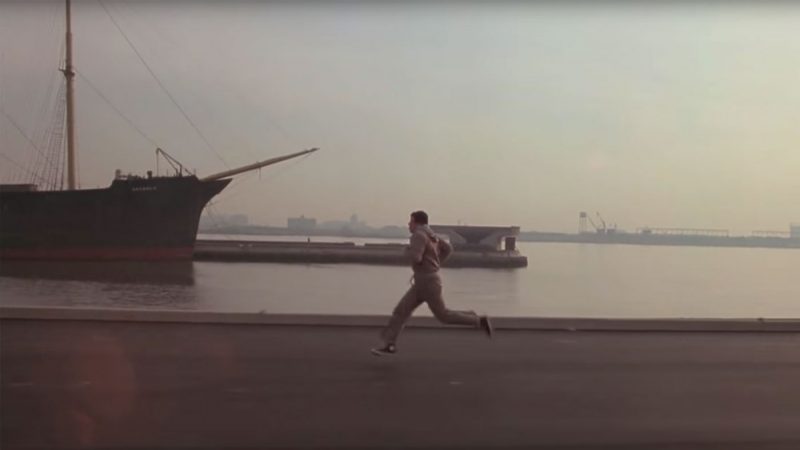 Rocky running along the waterfront.