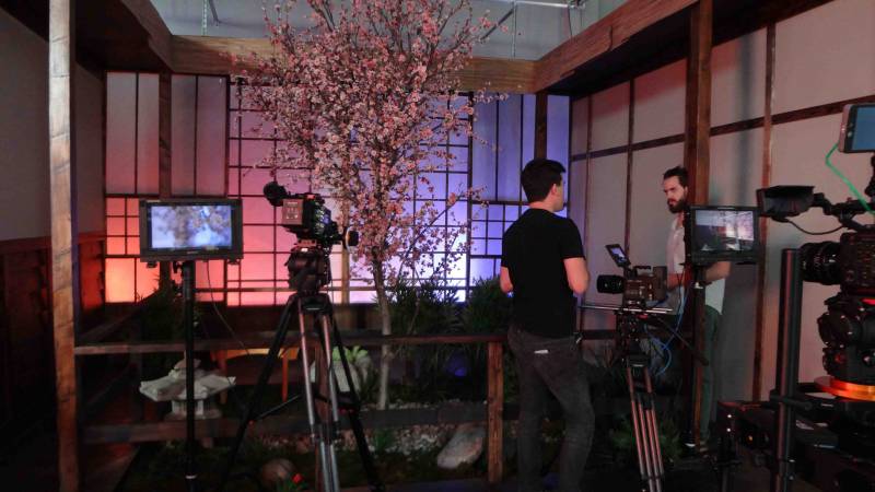 tow men and camera gear in the Sigma Cine Burbank Japan room