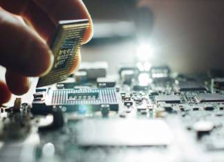 Hand placing a computer component on a motherboard