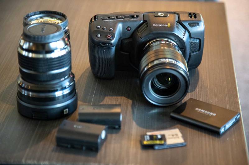Blackmagic Designs Pocket Cinema 4k camera with Canon EP-L6 batteries, SD, C fast 2.0 and SSD media storage. Also pictured three micro four thirds lenses.