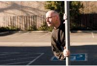 Split Screen: A man appears to be coming right out of a pole