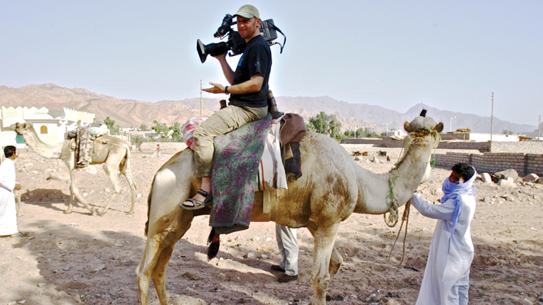 Cinematographer Gavin Thurston on a camel in Egypt.