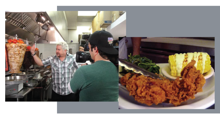 Guy with chef and a fried chicken and corn on the the cob dish. 