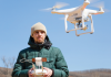 Take Flight with These 8 Must-have Drone Shots Person flying a drone.