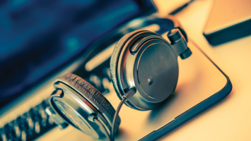 Guide to Audio Editing Software Headphones on a laptop