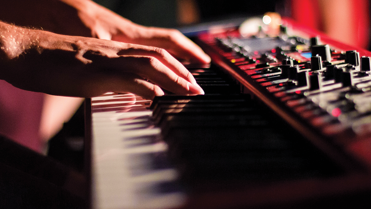 Close-up of hands on a keyboard